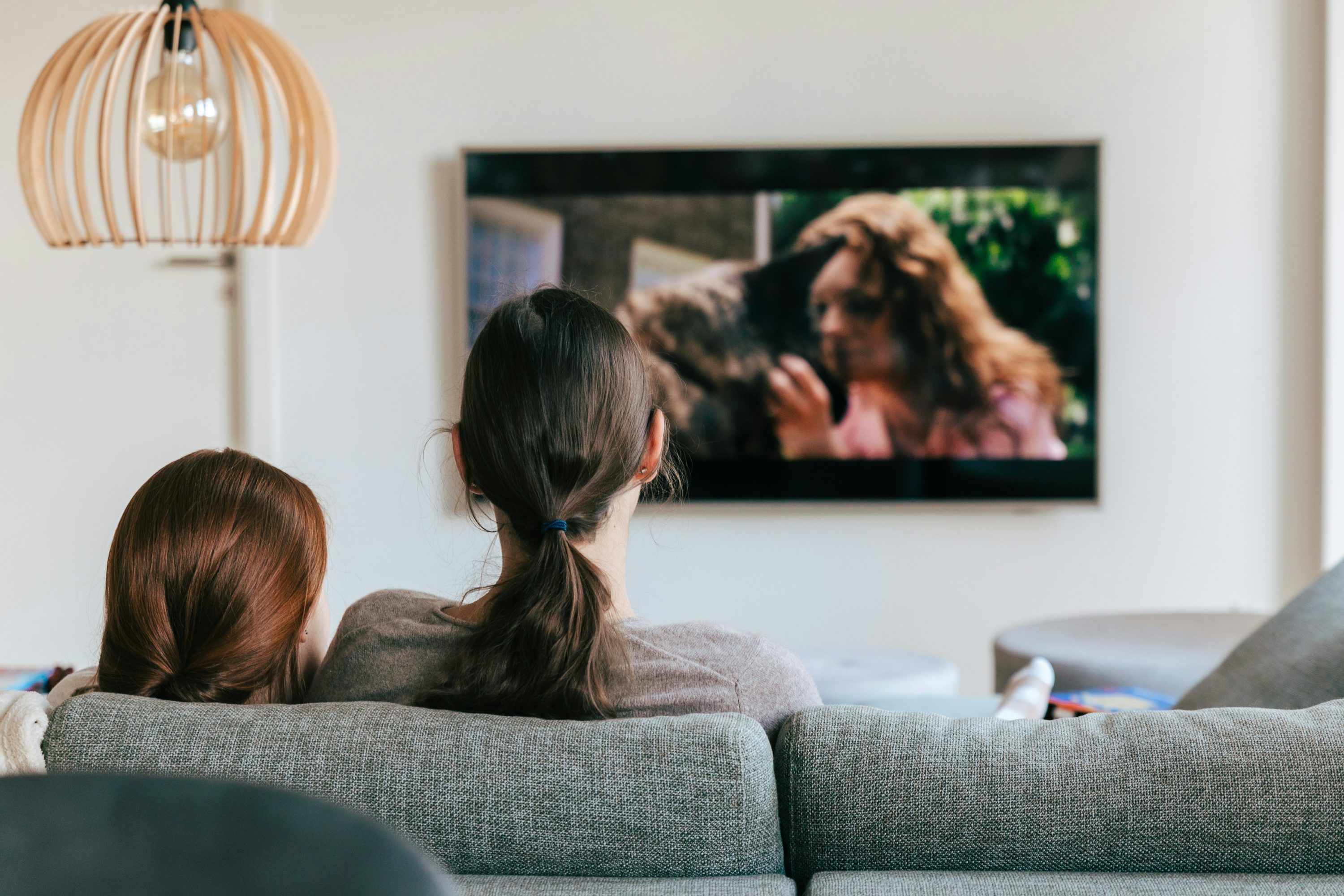 Family watching live TV through Kyro Player Xtream Codes connection on a large screen