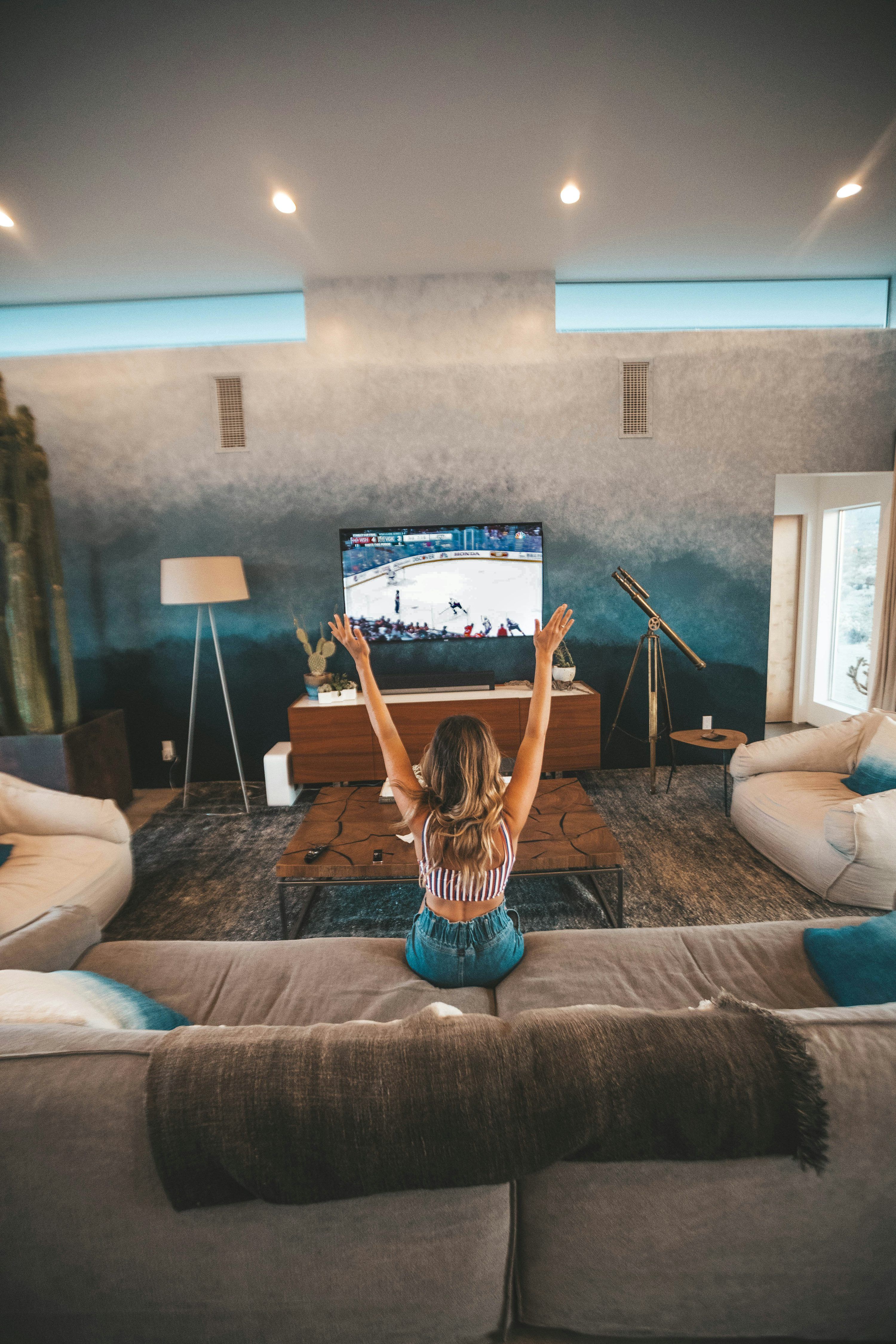 Family watching 4K HDR content on a big screen TV using Kyro Player with Xtream Codes streaming