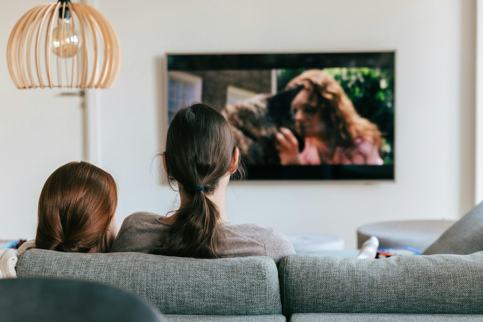 Family watching live IPTV streams on a TV using an M3U player